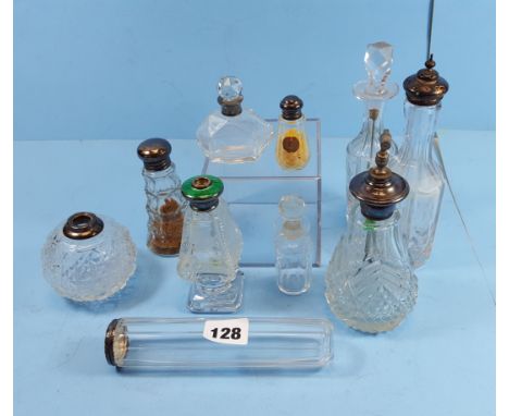 A STERLING SILVER MOUNTED CUT GLASS SCENT ATOMISER, a ditto with green enamel collar (lacks pump), an Edwardian silver topped
