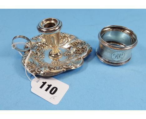 AN AMERICAN GORHAM STERLING SILVER FLORAL DECORATED LEAF SHAPED CHAMBER STICK and a circular silver NAPKIN RING, Birmingham 1