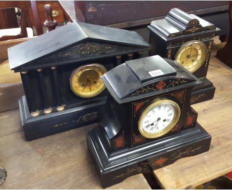 A VICTORIAN FRENCH BLACK AND COLOURED MARBLE INSET MANTLE CLOCK, circular dial with twin train movement (strike a.f), 11 ins 