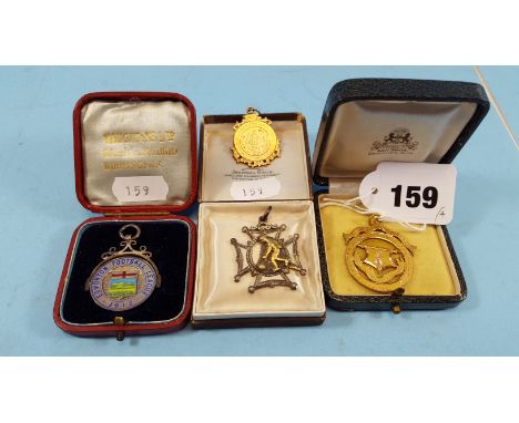 A YELLOW METAL 1913 EDMONTON ASSOCIATION FOOTBALL LEAGUE "PROVINCIAL CHAMPIONS" MEDAL (9 grams), a ditto 1910 MEDAL (5.8 gram