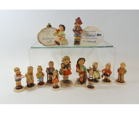 A GOEBEL HUMMEL "AUTHORISED DEALER" PLAQUE with boy and slate figure, 5 ins high a ditto Millennium 2000 PLAQUE, 4 ins high, 