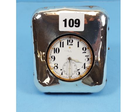 AN EDWARDIAN NICKEL PLATED 8 DAY GOLIATH POCKET WATCH, enamel dial with subsidiary seconds, in a silver fronted TRAVELLING CA