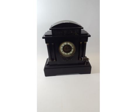 MOUGIN, FRANCE, A LATE VICTORIAN/EDWARDIAN ARCHITECTURAL SLATE MANTLE CLOCK, twin train movement with classical bronze frieze