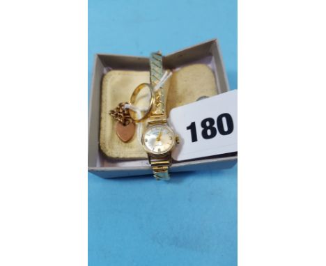 A 14K YELLOW GOLD BAND RING, approximately 2.4 grams, a 9ct gold PADLOCK AND CHAIN (1.6 grams) and a lady's 9ct gold "ROTARY"