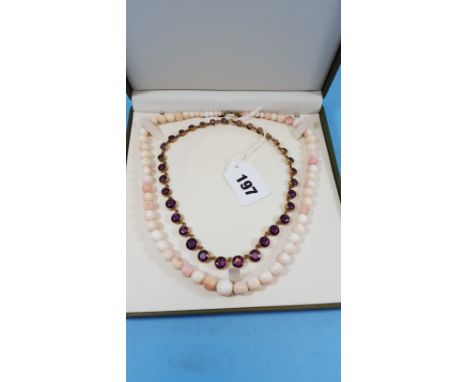 AN EARLY 20TH CENTURY ANGEL SKIN GRADUATED CORAL BEAD NECKLACE and a Victorian graduated amethyst coloured facet cut NECKLACE
