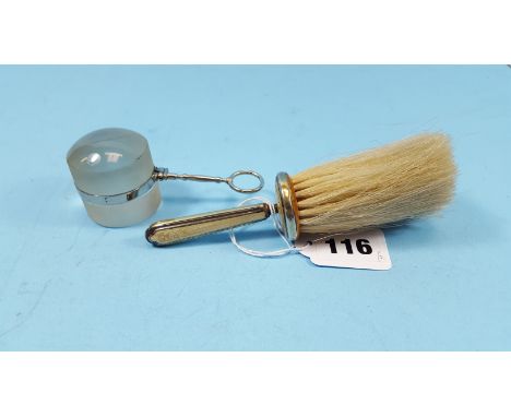 A GEORGE V SILVER AND YELLOW ENAMEL DUSTING BRUSH, Birmingham 1935 and a nickel plated handled MAGNIFYER.  (2)   