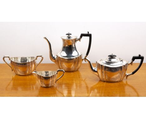 Edward VII silver four piece tea service comprising a teapot, hot water jug, cream jug and twin handled sucrier, with foliate