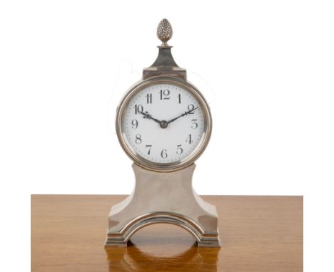 George V silver-cased balloon clockthe case with pineapple pediment, with a circular dial on a waisted base, the white enamel
