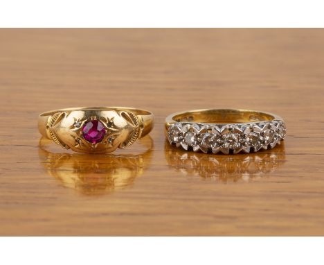 Two 18ct gold ringsthe first set with seven diamonds, size P, the other set with a facet cut ruby, size T, 7g approx overall 