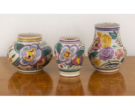 Truda Carter for Poole Pottery Three ceramic vases decorated with stylised flowers by Hilda Hampton, the widest with impresse