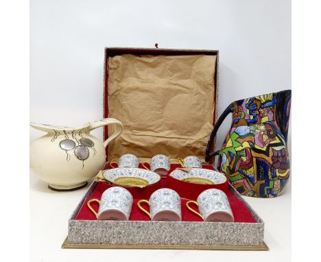 A set of six Limoges coffee cans and saucers, cased, and two jugs (3) 