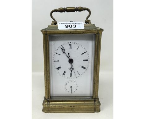 A carriage clock, with a repeat and an alarm, in a brass and glass case, 16 cm high 