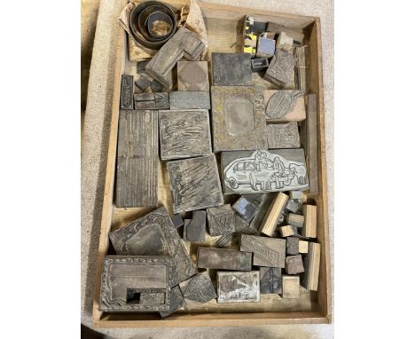 A large quantity of vintage printing letter and image blocks, in thirteen trays 