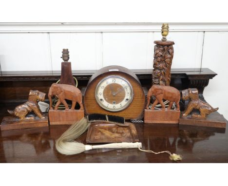 A mixed lot to include carved Oriental table lamp, another carved table lamp, pair of folding elephant bookends, pair of carv