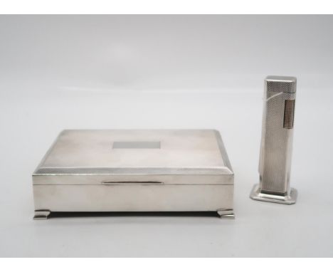 An Elizabeth II silver cigarette box, by H Bros, Birmingham, of rectangular form, with engine-turned decoration, and a Dunhil