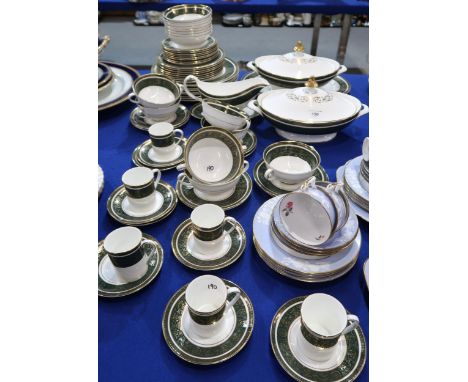 A Royal Doulton Vanborough pattern dinner service comprising eight dinner, medium and side plates, two tureens, oval platter,