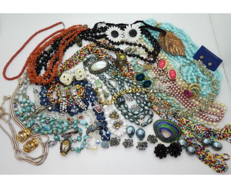 Two strings of coral beads, a pewter Jorgen Jensen ring, a Burns Fereration badge, a white metal enamel and gem birds brooch 