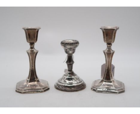 A pair of silver candlesticks, by James &amp; William Deakin, Chester, of faceted form, and another silver candlestick, by Wi