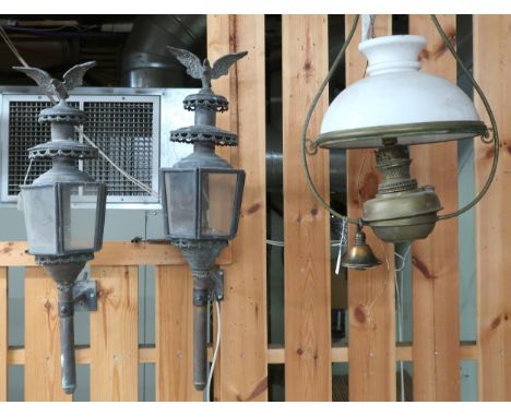 A lot comprising pair of 19th century carriage lamps with eagle surmounts, 79cm high and a Victorian brass hanging paraffin l