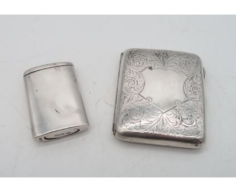 A silver cigarette case by William Hair Haseler, Birmingham, with scrolling foliate decoration, and a vacant escutcheon-shape