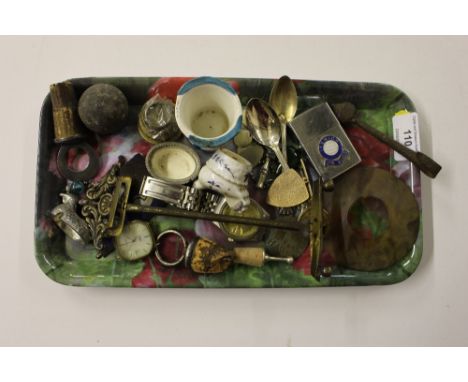 A tray containing a lighter and various sundries 