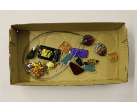 A tray of various pendants 