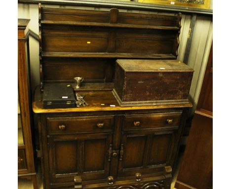 A dark Ercol dresser fitted two drawers