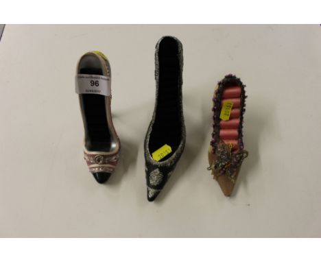 Three ring stands in the form of ladies shoes