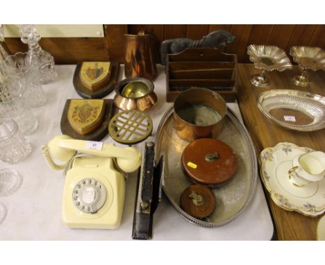 Two heraldic crests; a dial telephone; a desk calendar; a silver plated tray; a stationery rack; a doorstop in the form of a 