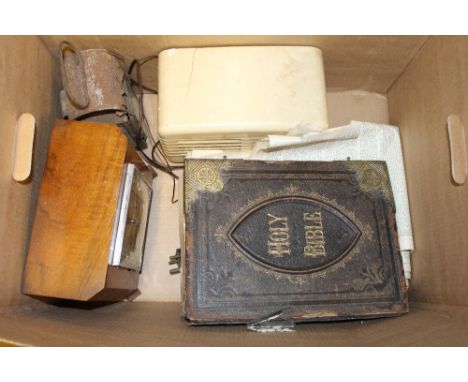 A box containing a Victorian leather bound Bible  AF; a walnut mantel clock; a lamp; and an old radio - sold as collector's i