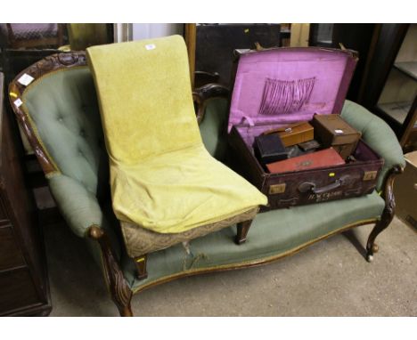 A Victorian walnut button back couch, raised on cabriole supports 