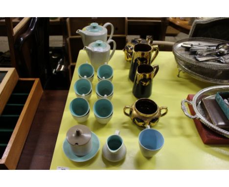 A quantity of Poole twin tone coffeeware; and gilt decorated teapot and matching jugs etc. 