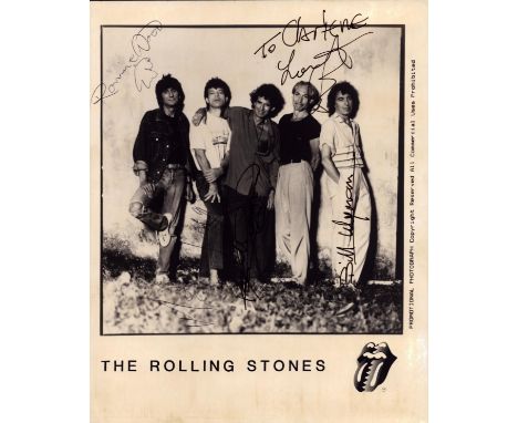 The Rolling Stones multi signed 10x8 inch promo photo. Signatures from all five members Ronnie Wood, Mick Jagger, Bill Wyman,