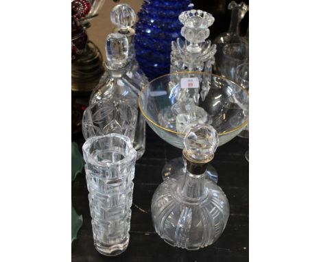 Group of cut glass wares including four decanters, a glass tazza with gilt rim and two glass vases and a glass candlestick mo