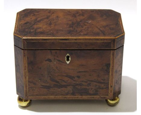 Mid 19th century grained mahogany caddy with inlay and ivory escutcheon, the caddy raised on four brass ball feet, 19cm long 