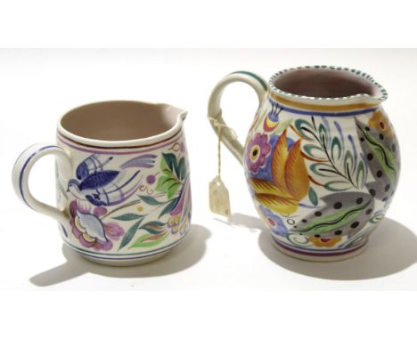 Two Poole Pottery jugs, one with a bluebird type design by Betty Godby circa 1950s, together with a further Poole Pottery jug