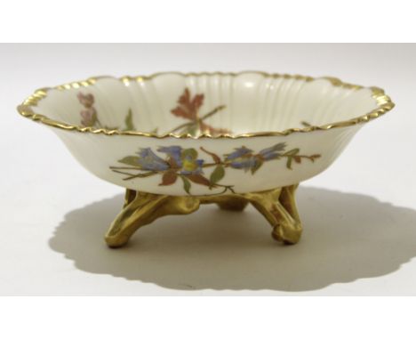 Royal Worcester blush ground dish with gilt edge, the reeded dish with floral decoration and gilt branch feet, Worcester puce