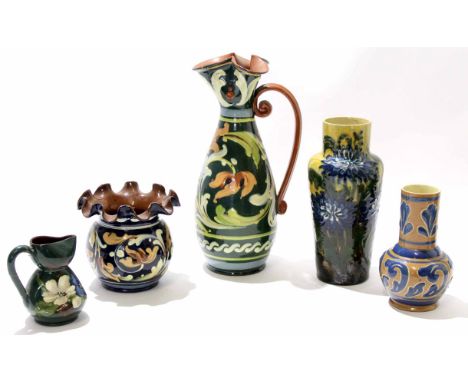 Group of pottery Aller Vale wares with various slip designs comprising large jug, vase, further vase, and a small jug, larges