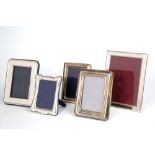 Five silver photo frames