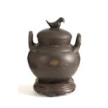 Bronze pot with base and lid