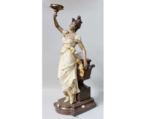 A Late 19th Century French Painted and Bronzed Figural Lamp, in the form of a lady holding aloft light, with urn on plinth ba