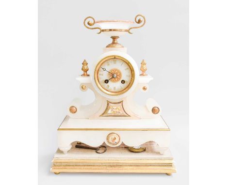 An Alabaster Striking Mantel Clock, circa 1890, case surmounted by an urn finial, twin barrel movement striking on a bell, ra