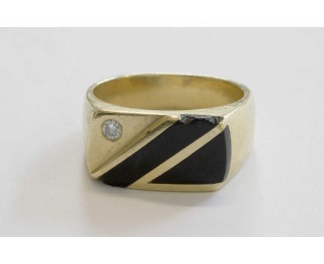 A Diamond and Onyx Signet Ring, stamped '14K', finger size U1/2 (a.f.)Gross weight 11.7 grams.