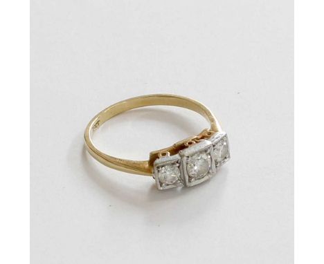 A Diamond Three Stone Ring, the graduated round brilliant cut diamonds in white square settings, to a yellow tapered shoulder