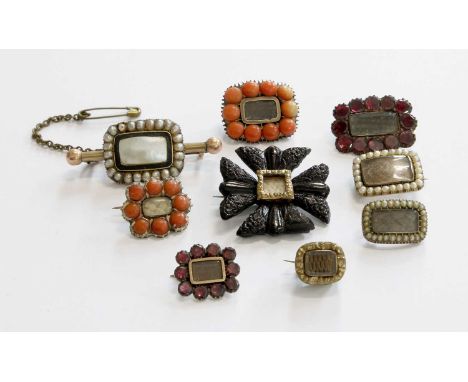 Eight Mourning Brooches, each with locket compartments to the centre allowing for hair work, including two coral examples, tw