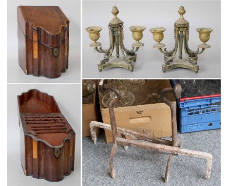 George III Crossbanded Mahogany serpentine knifebox, a pair of andirons and a pair of Adams styles twin light desk candle hol