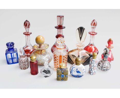 A Collection of Glass Scent Bottles and Stoppers, predominantly 20th century, to include ruby fash, pewter, amber coloured an