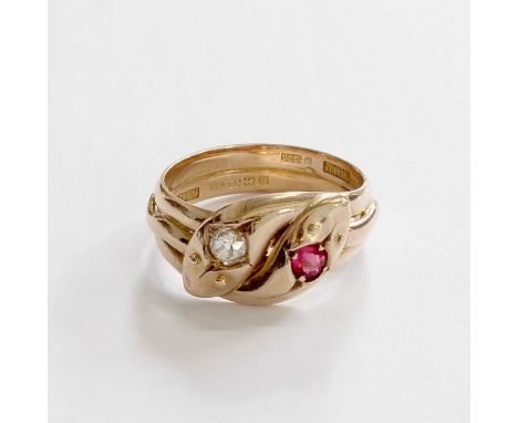 A 9 Carat Gold Pink Stone and Diamond Snake Ring, the yellow serpent heads inset with a round cut pink stone and an old cut d