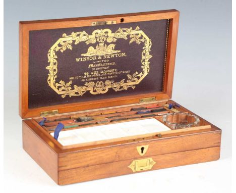 A late Victorian mahogany cased artist's box by Winsor &amp; Newton, 'By Appointment to Her Majesty', the lid interior inset 