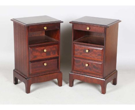 A pair of late 20th century Stag hardwood bedside chests, each with slide, open shelf and two drawers, height 66cm, width 41c